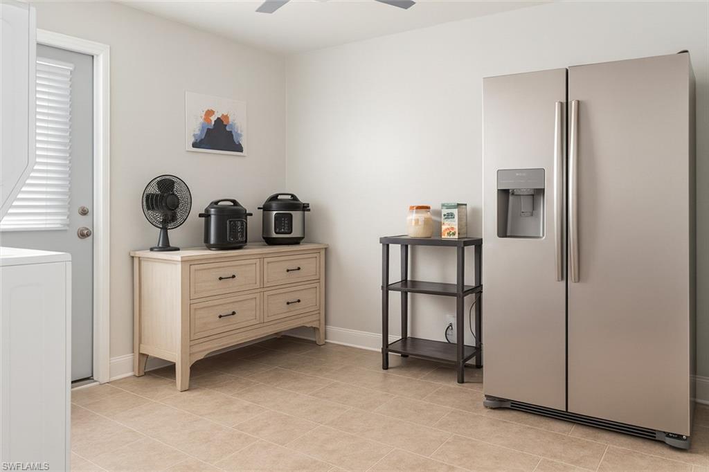 5010 31st Avenue Southwest Naples, FL 34116 - Photo 24 of 33 a room with storage and utility