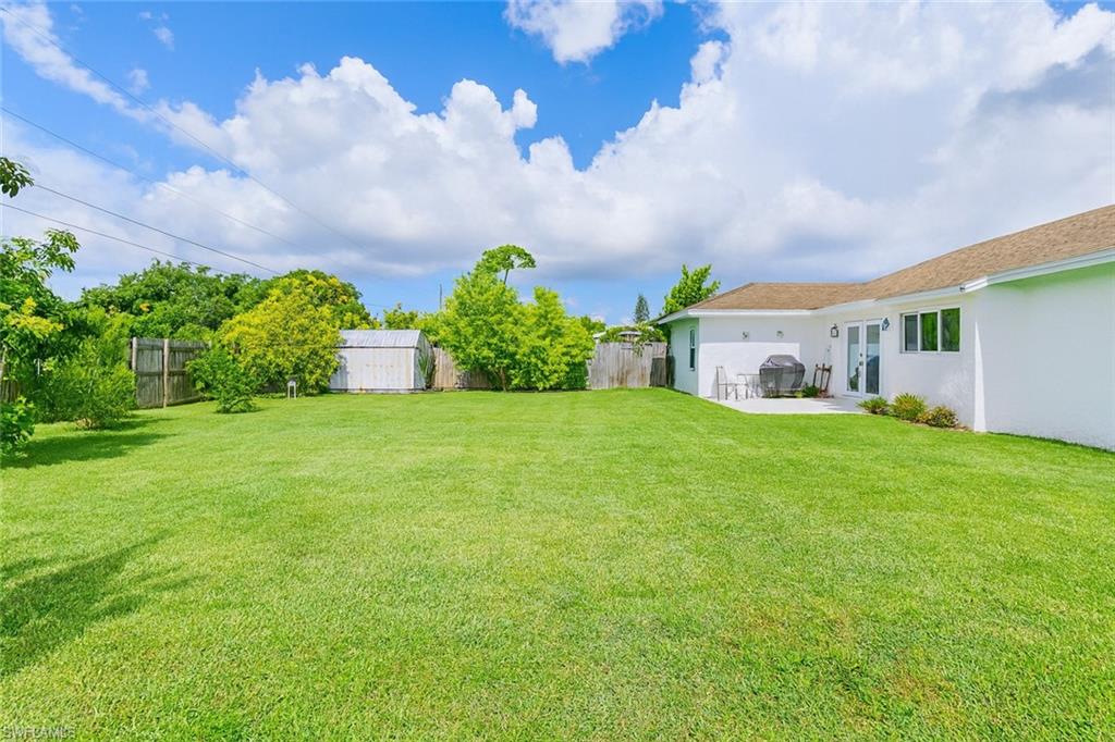 5010 31st Avenue Southwest Naples, FL 34116 - Photo 27 of 33 a front view of house with yard and green space