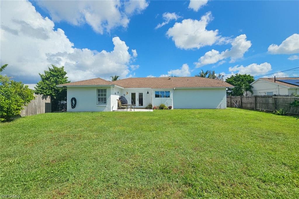 5010 31st Avenue Southwest Naples, FL 34116 - Photo 28 of 33 a front view of a house with a garden