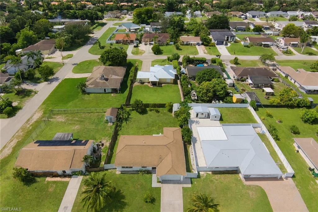 5010 31st Avenue Southwest Naples, FL 34116 - Photo 31 of 33 an aerial view of residential houses with outdoor space