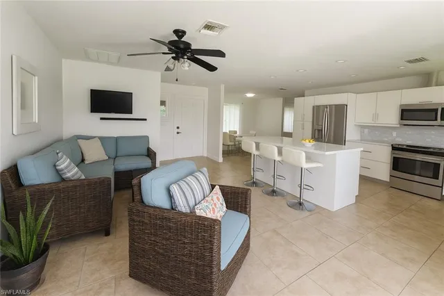 a living room with furniture and a flat screen tv