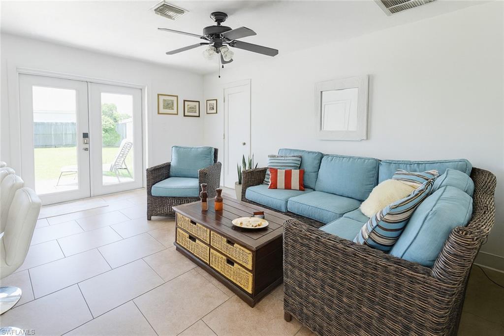 5010 31st Avenue Southwest Naples, FL 34116 - Photo 5 of 33 a living room with furniture and a window