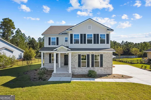 an aerial view of house with yard swimming pool and outdoor seating