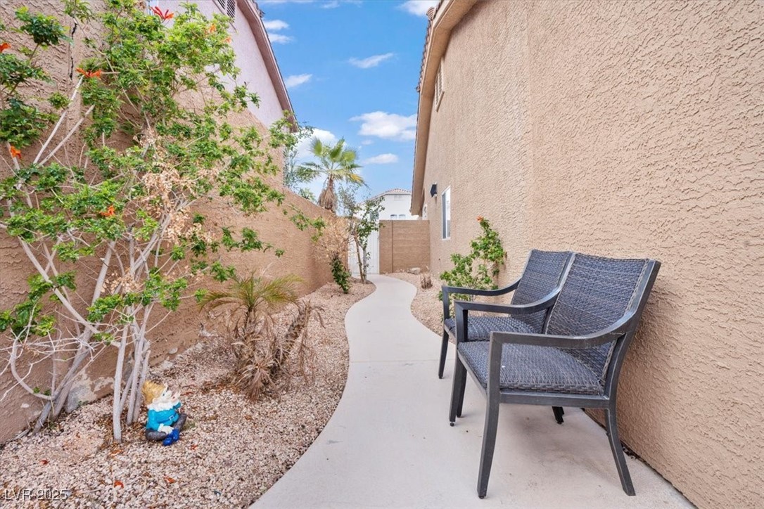 9031 West Viking Road Las Vegas, NV 89147 - Photo 33 of 33 View of patio / terrace with fence