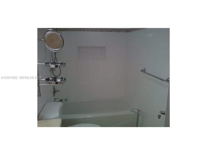 150 Southeast 25th Road, Unit 8L Miami, FL 33129 - Photo 6 of 12 a bathroom with a sink