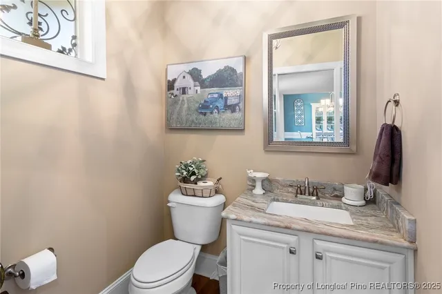 a living room with a fireplace and a flat screen tv