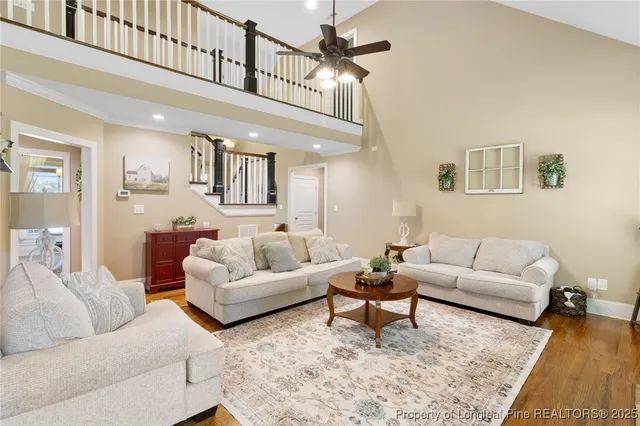 a kitchen with kitchen island granite countertop a refrigerator and a stove top oven