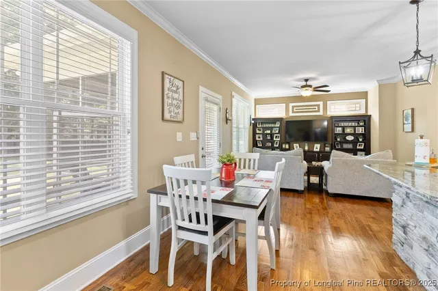 a kitchen with stainless steel appliances granite countertop a refrigerator sink and stove