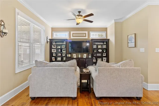 a kitchen with stainless steel appliances granite countertop stove a sink dishwasher and a refrigerator with wooden floor