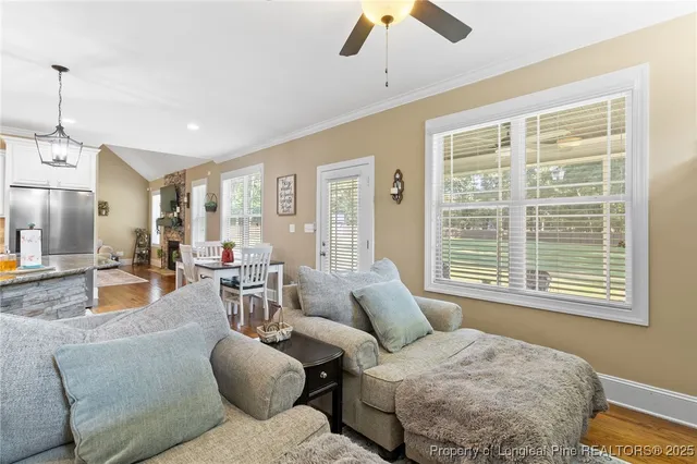 a kitchen with granite countertop white cabinets stainless steel appliances and a counter space
