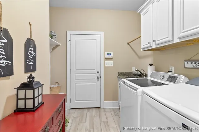 a spacious bathroom with a granite countertop sink a mirror a vanity and a shower