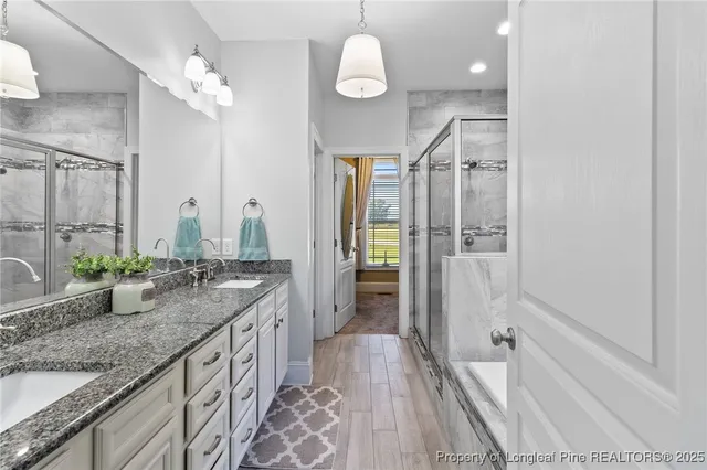 a bed room with a bed and a chandelier