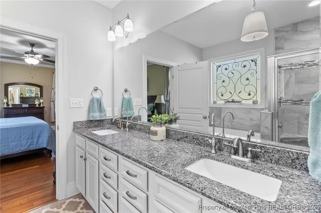 a bathroom with a sink a toilet and shower curtain