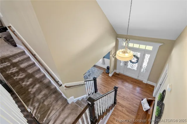 a view of a lounge chairs in the back yard of the house