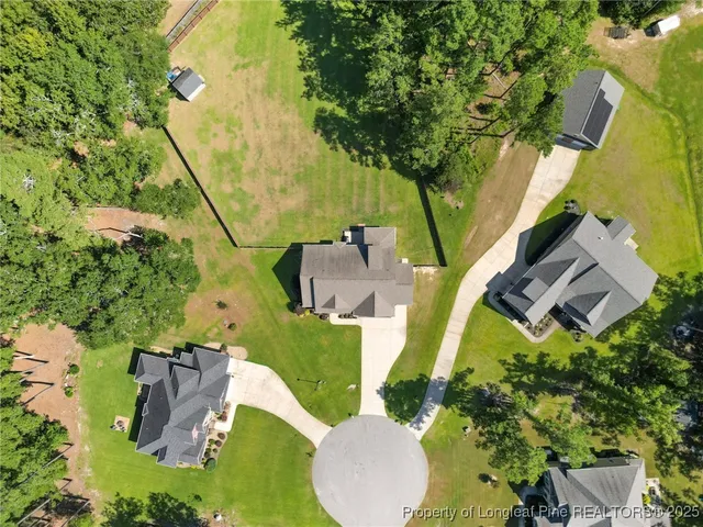 a house view with swimming pool in front of it