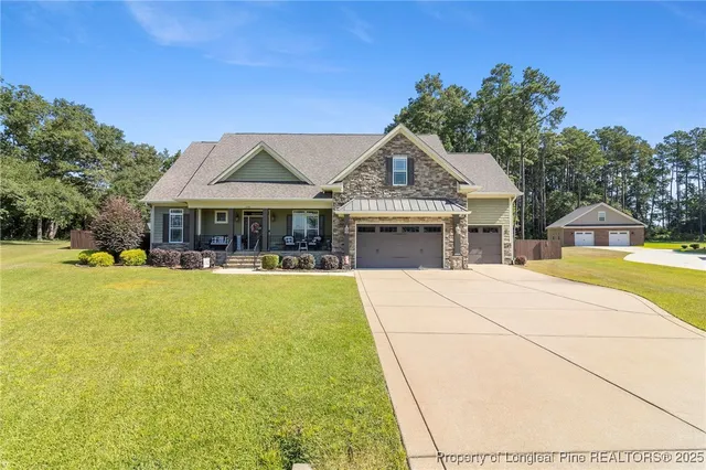 a view of a house with swimming pool and porch