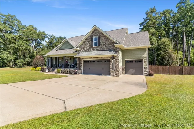 a bathroom with a granite countertop toilet a sink and a mirror