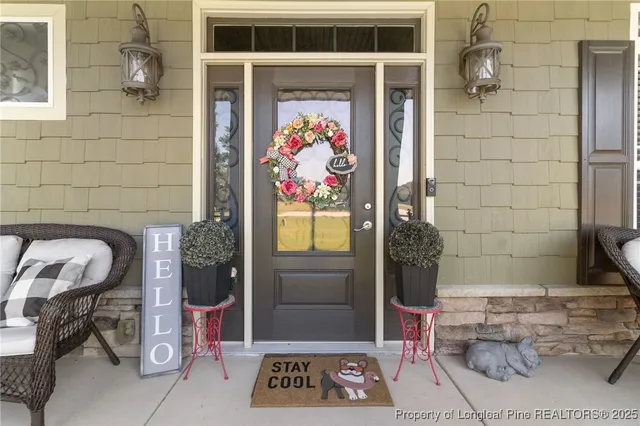 a outdoor dining space with furniture and window