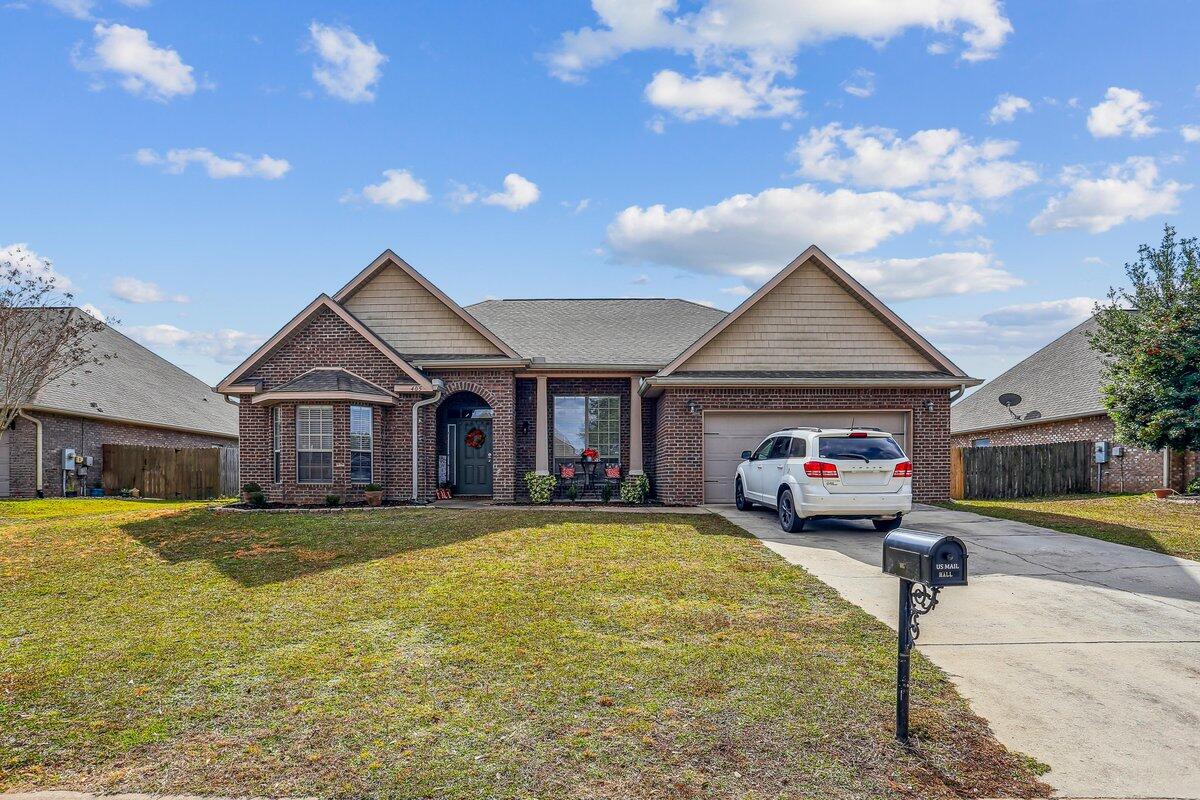 a front view of a house with a yard