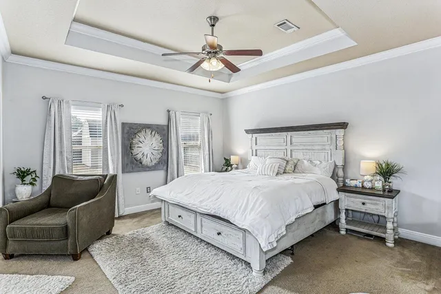 a view of walk in closet with clothes