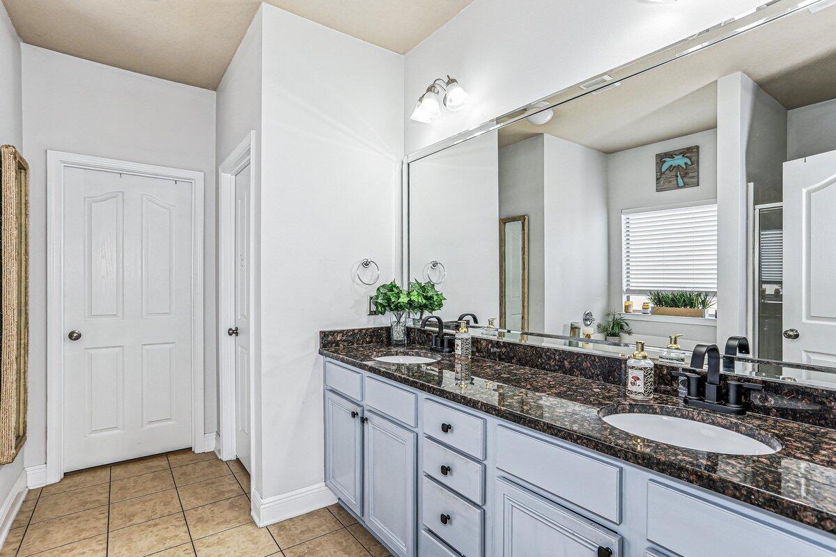 405 Pendo Place Crestview, FL 32536 - Photo 20 of 39 a bathroom with a granite countertop sink and a mirror
