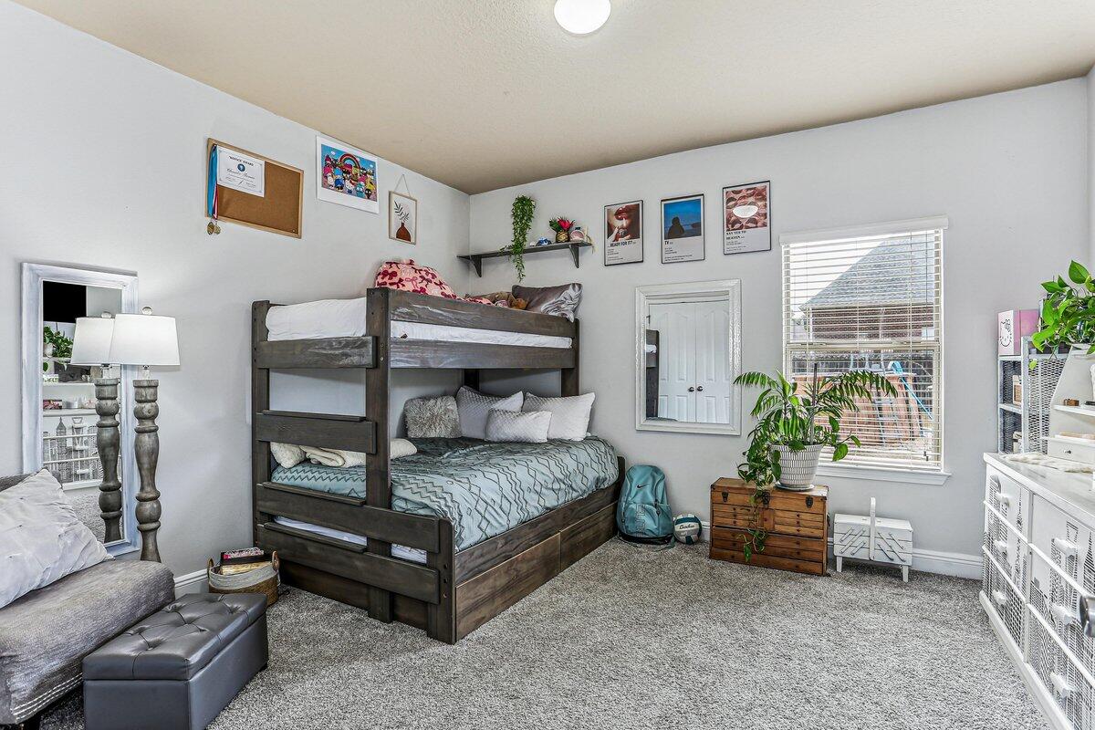 405 Pendo Place Crestview, FL 32536 - Photo 25 of 39 a bedroom with furniture a ceiling fan and a window