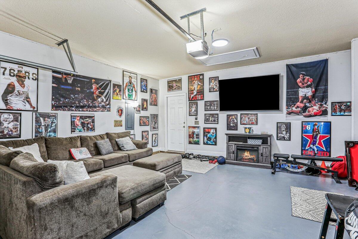 405 Pendo Place Crestview, FL 32536 - Photo 29 of 39 a living room with furniture and a flat screen tv