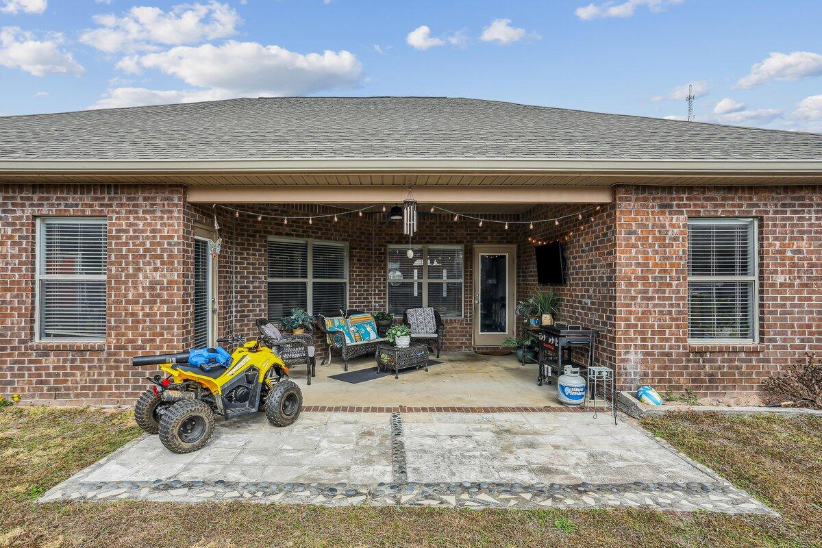 405 Pendo Place Crestview, FL 32536 - Photo 34 of 39 a view of a house with sitting area and furniture
