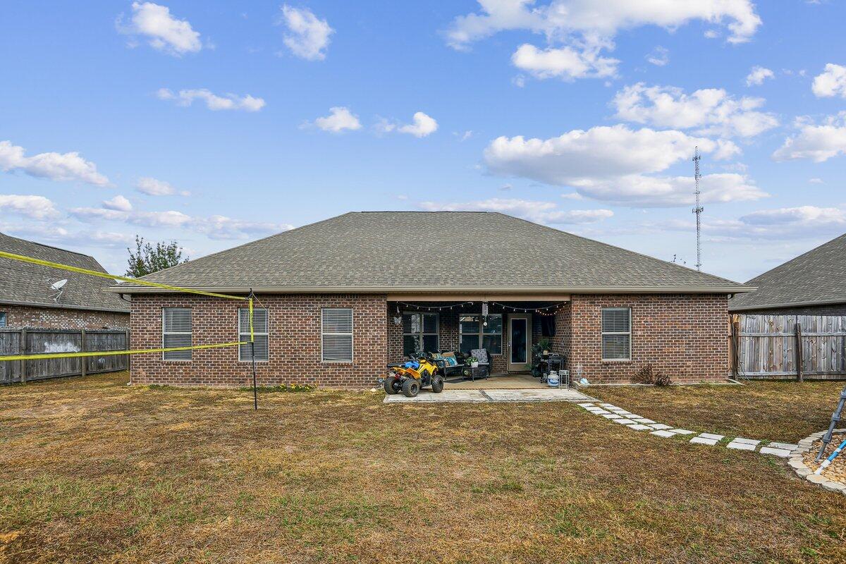 405 Pendo Place Crestview, FL 32536 - Photo 36 of 39 a front view of a house with a yard