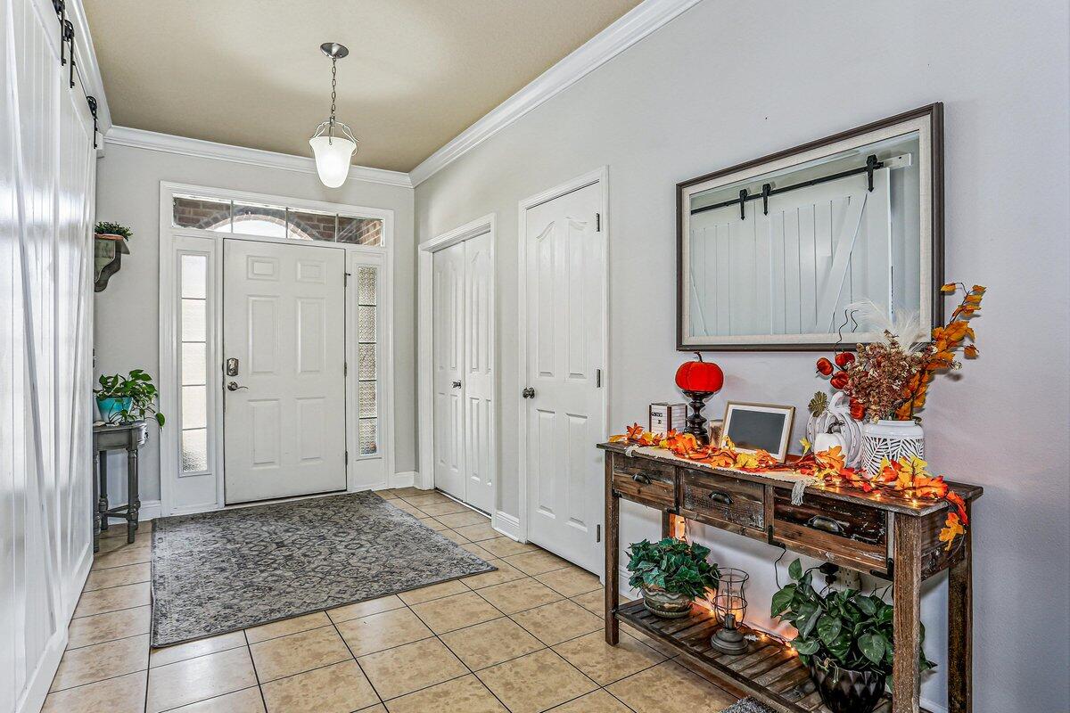 405 Pendo Place Crestview, FL 32536 - Photo 5 of 39 a view of an entryway with wooden floor