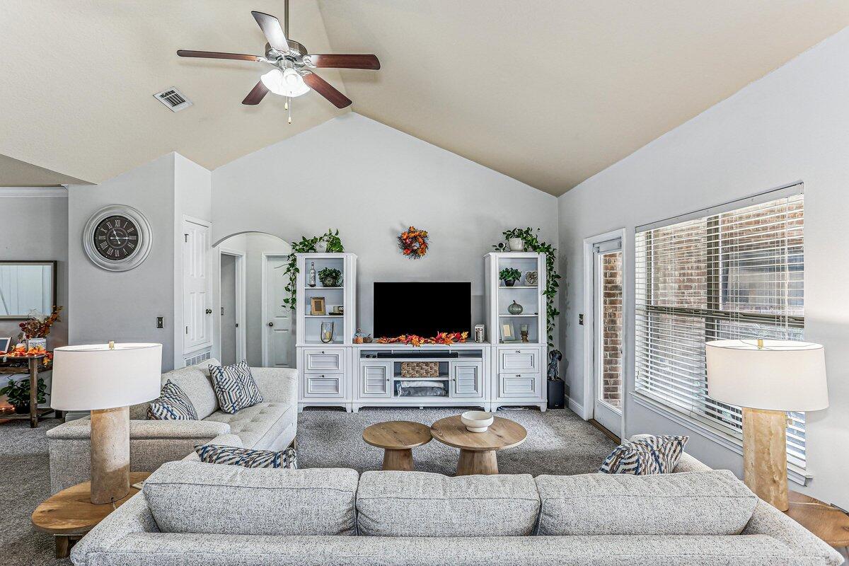 405 Pendo Place Crestview, FL 32536 - Photo 8 of 39 a living room with furniture and a flat screen tv