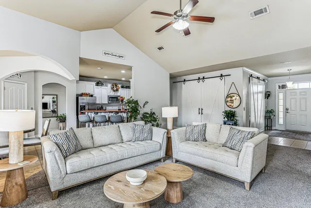 a entryway with furniture and a chandelier