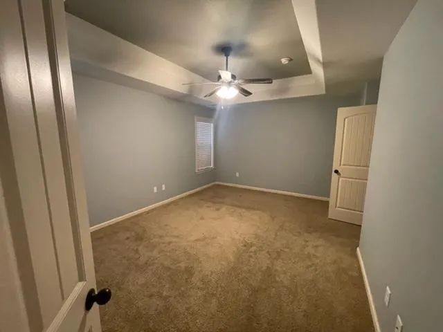 a bathroom with a toilet sink shower and mirror