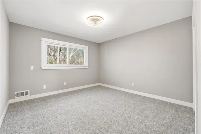 a bathroom with a sink toilet and vanity