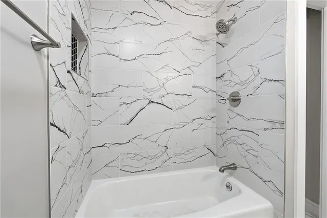 a view of a room with wooden walls