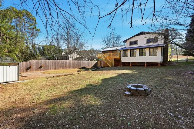an aerial view of a house with a swimming pool
