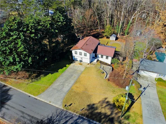 an aerial view of a house with outdoor space