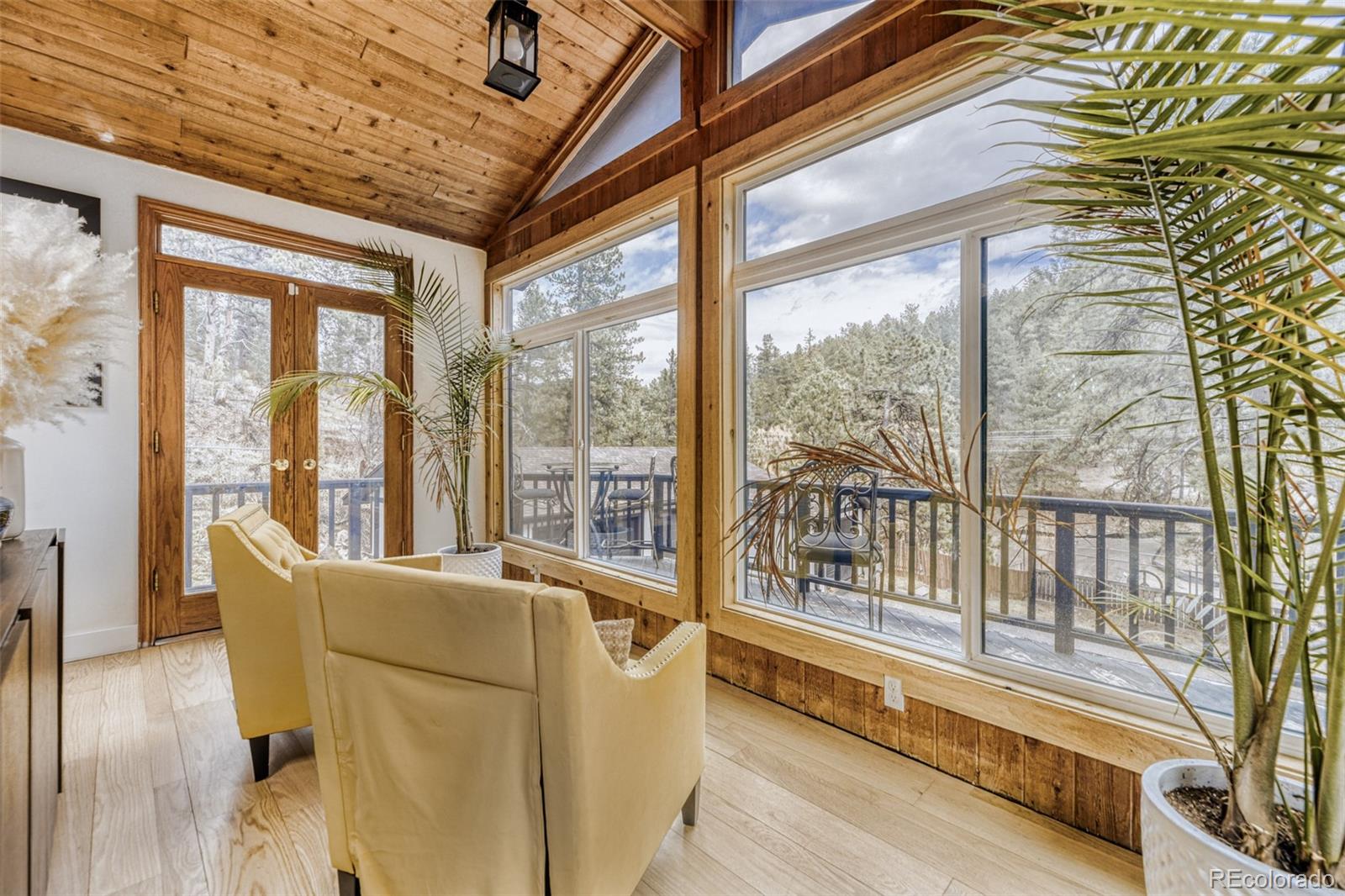 7489 South Turkey Creek Road Morrison, CO 80465 - Photo 6 of 28 a living room with furniture and a large window