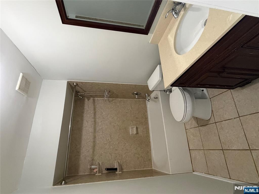 192 Burnett Avenue Maplewood, NJ 07040 - Photo 8 of 13 a bathroom with a sink a toilet and bathtub
