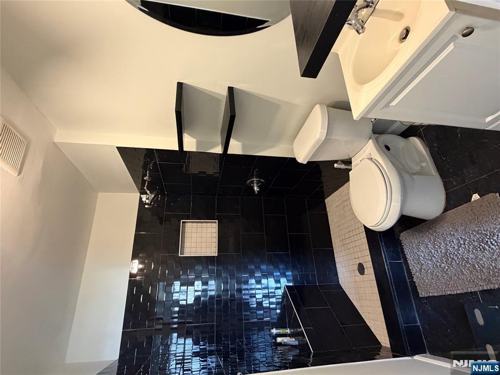 192 Burnett Avenue Maplewood, NJ 07040 - Photo 9 of 13 a bathroom with a toilet and a shower