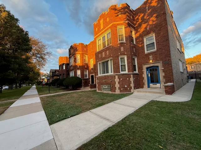 a view of a building with a yard