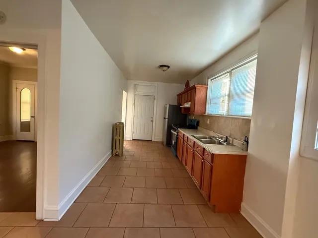 a kitchen with stainless steel appliances a sink and a stove top oven