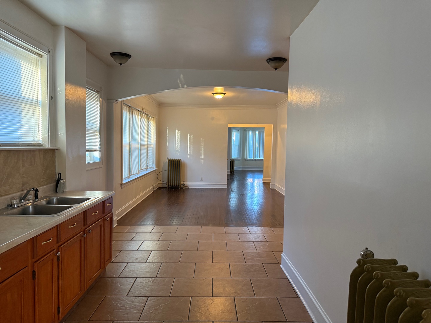 7749 South Indiana Avenue, Unit 1 Chicago, IL 60619 - Photo 7 of 13 a lobby with a sink and a mirror