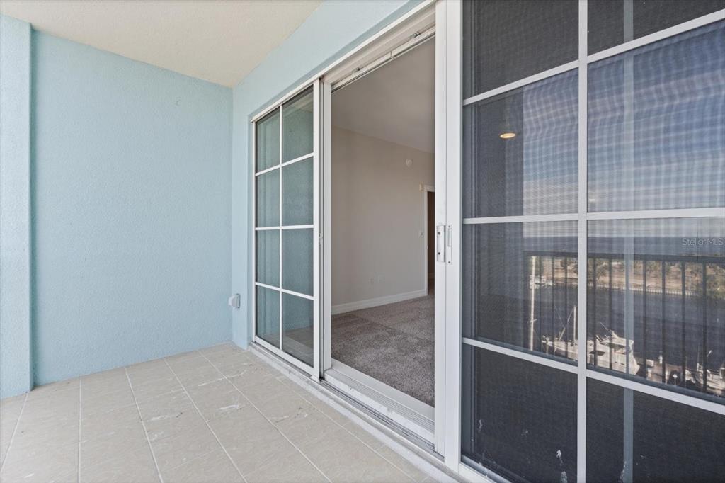 536 Bahia Beach Boulevard, Unit 428C Ruskin, FL 33570 - Photo 11 of 30 a view of an empty room with a glass door