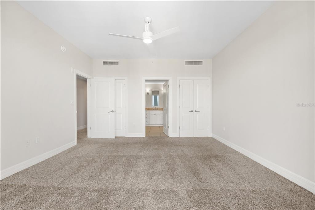 536 Bahia Beach Boulevard, Unit 428C Ruskin, FL 33570 - Photo 14 of 30 a view of an empty room with a ceiling fan