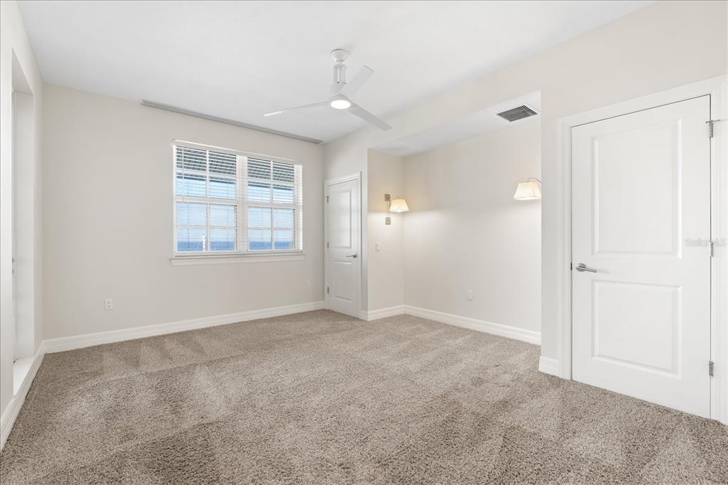 536 Bahia Beach Boulevard, Unit 428C Ruskin, FL 33570 - Photo 18 of 30 an empty room with windows and closet