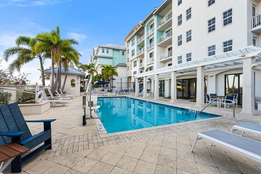 536 Bahia Beach Boulevard, Unit 428C Ruskin, FL 33570 - Photo 22 of 30 a view of a swimming pool with chairs