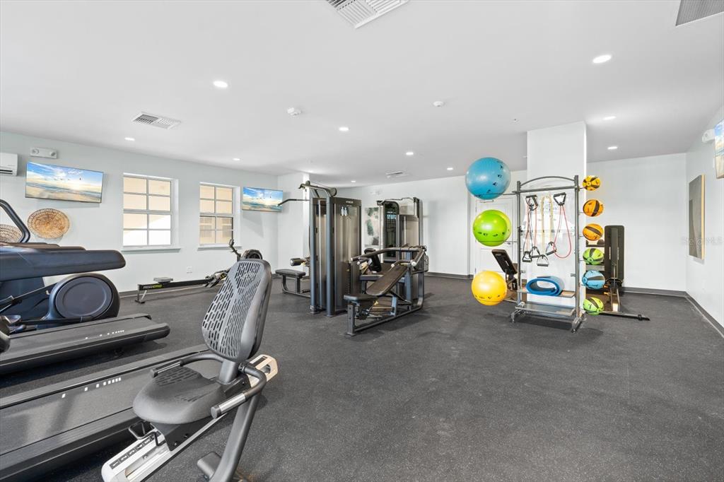 536 Bahia Beach Boulevard, Unit 428C Ruskin, FL 33570 - Photo 26 of 30 a view of a room with gym equipment