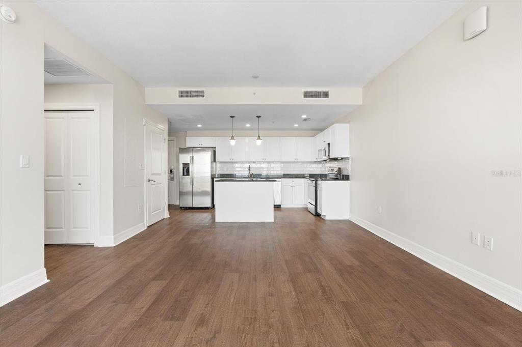 536 Bahia Beach Boulevard, Unit 428C Ruskin, FL 33570 - Photo 6 of 30 a big room with wooden floor and windows