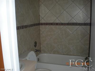 17160 Lee Road Fort Myers, FL 33967 - Photo 6 of 10 a bathroom with a bathtub